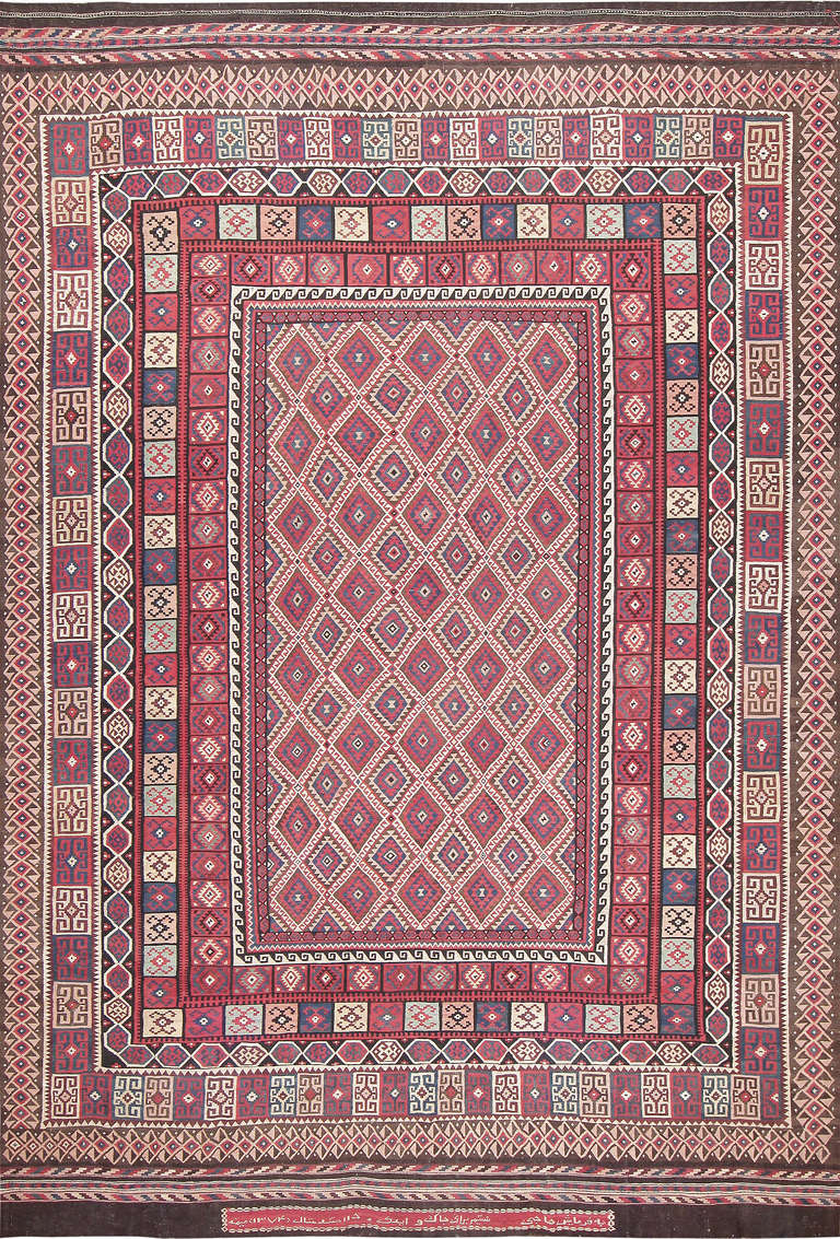 Here is a fantastic and truly unique vintage Persian rug, rendered in unusual proportions. Indeed, the extremely rare size of this piece tells us that it was in fact custom-made. Quite likely, this rug was ordered by an individual with the express