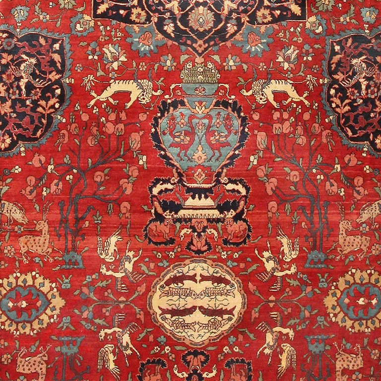 This magnificent antique Indian carpet showcases an exquisite allover arabesque executed in a posh decorator's color palette. Dainty leaflets, charming blossoms and botehs formed by arching floral sprays adorn the delicate low-contrast vine scrolls