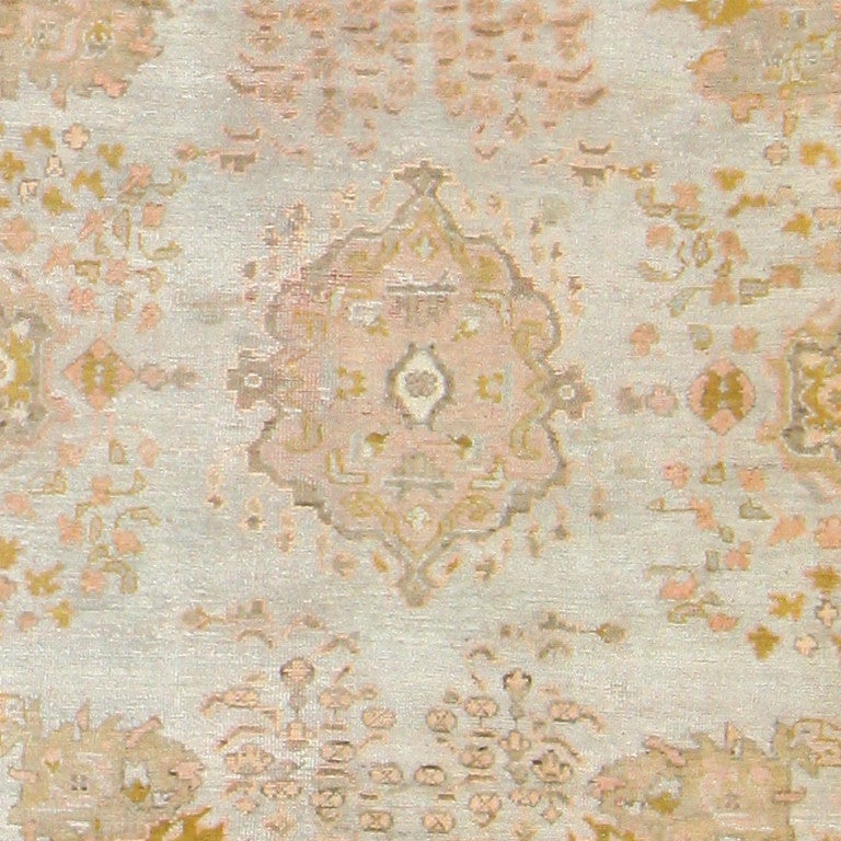 Antique Turkish Oushak rug, circa 1900. Oushak carpets are long-time favourites among admirers of antique Ottoman rugs. Originating in Turkish carpet weaving workshops, Oushak rugs were frequently represented in paintings by European masters, such