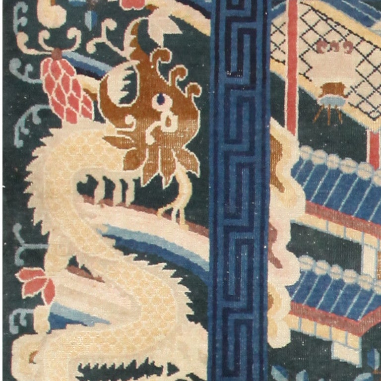 Rare antique dark green Chinese rug, China, early 20th century. This rare antique dark green Chinese rug is a commanding example of artisan ingenuity in design and color choice. The external border contains iterative dragon imagery which seems to