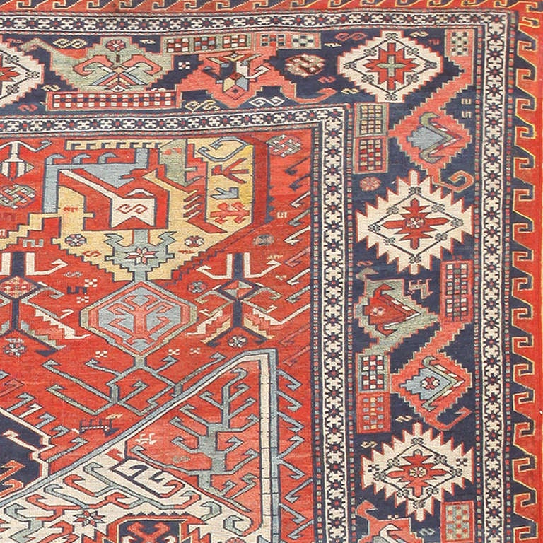 This magnificent antique Caucasian Soumak rug depicts a prototypical dragon medallion that lends itself well to the detailed weft wrapped weaving technique known as Soumak. Dueling medallion motifs with contrasting colors and radiant appendages