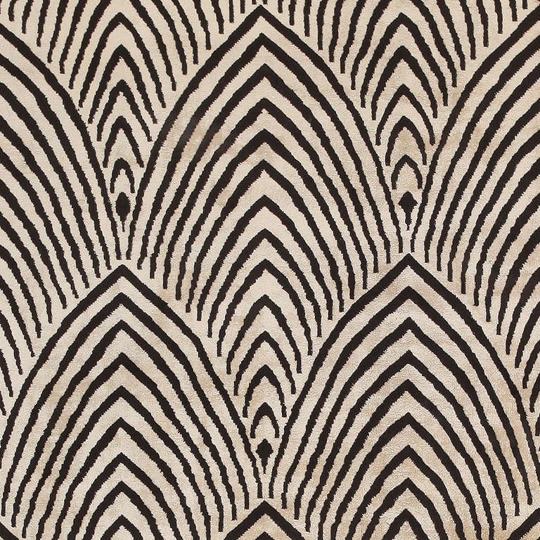 This exquisite Chinese art deco carpet showcases a superb allover pattern of graphic zebra-stripe lancets that have spectacular symmetry and strong op-art appeal. Pointed zebra stripes with a precise stacked arrangement form a series of staggered