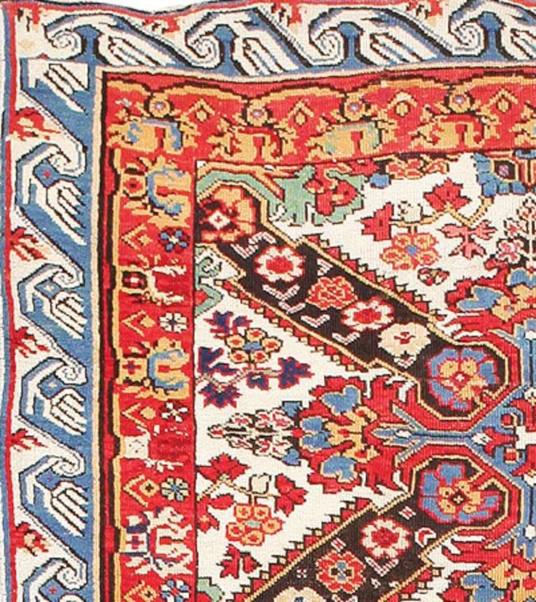 Here is an absolutely stunning antique Oriental rug - an antique Seychor runner rug, hand-woven by the great carpet-producers of the Caucasus around the turn of the twentieth century. Tribal rugs from the Caucasus have long been admired for their