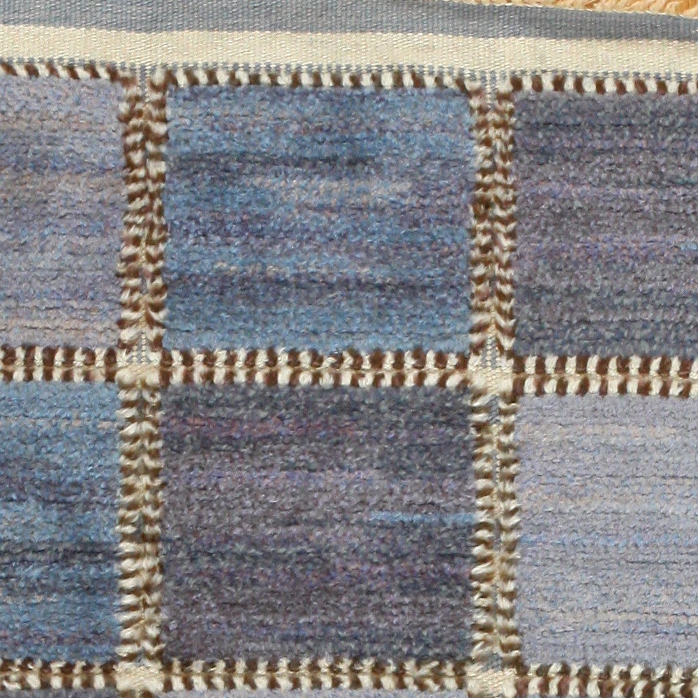 Vintage Rug by Barbro Nilsson for Marta Maas, Sweden, Mid 20th Century -- True to the elegantly understated atmosphere present in Swedish rugs, this piece showcases a simple pattern of squares, arranged in five rows of three. Blue is the defining