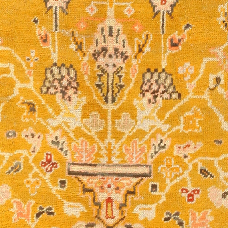 Antique Turkish Oushak Rug, Country of Origin: Turkey, Circa Date: 1900. Size: 8 ft 8 in x 13 ft 2 in (2.64 m x 4.01 m)

Bold and richly bright, this striking Oushak carpet features precise, artful detail upon a field of striking rich saffron. Woven