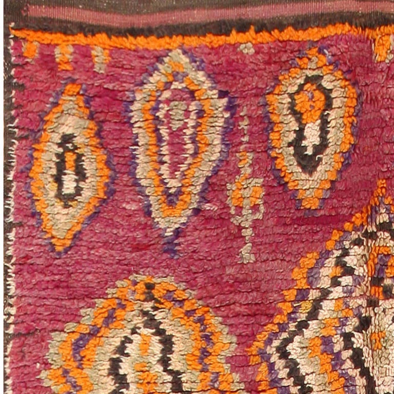 Vintage Moroccan rug, Morocco, mid-20th century. Size: 4 ft 5 in x 13 ft 10 in (1.35 m x 4.22 m)

Here is a beautiful vintage Moroccan rug, characterized by a vibrant pallet and a tribal, abstract design. Prized for their tribal authenticity and