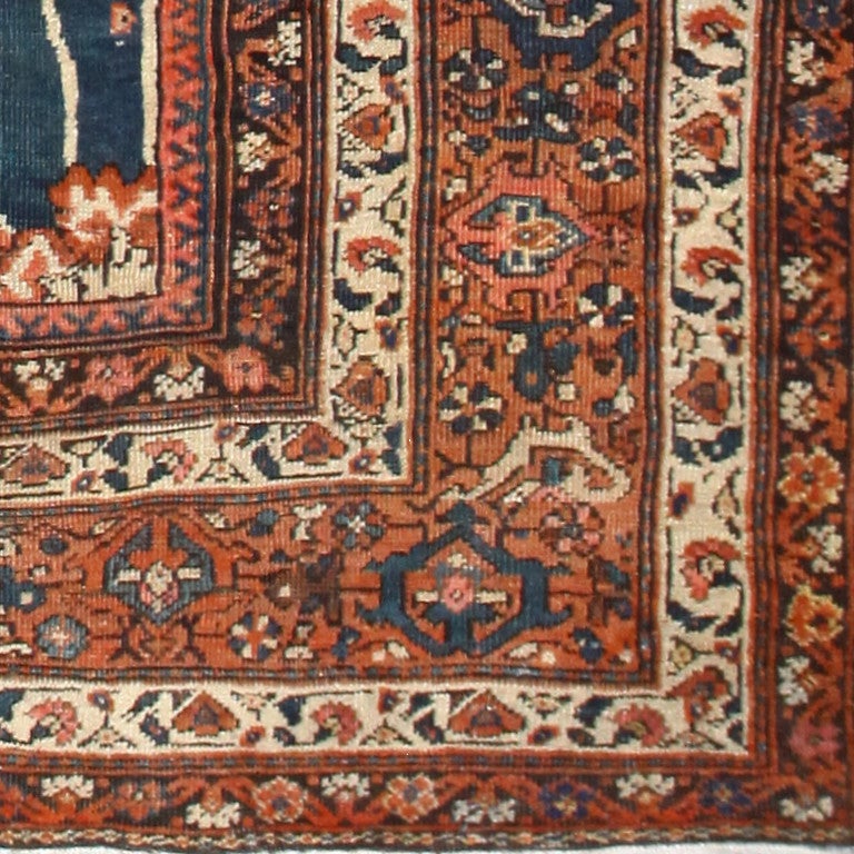 Antique Sultanabad Rug, Country of Origin: Persia, Circa 1900 -- This beautiful, square Sultanabad rug displays an attractive degree of symmetry. Dark reds contrast with the softer blue tones to create an ethereal piece that seems to spring to life