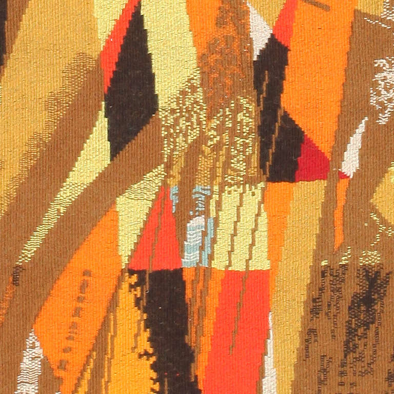 This phenomenal vintage French tapestry showcases a splendid cubist composition featuring chestnut browns and radiant warm tones that emphasize the tapestry's mid-century visage. Sensuous corporal curves sweep over the field and carry the eye across