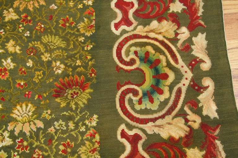 This extremely elegant antique Ukrainian needlepoint derives from Rococo and Aubusson tapestry designs.

Rare green background needlepoint antique Ukrainian rug, Origin: Ukraine, Circa: Late Nineteenth Century – Here is beautifully woven and