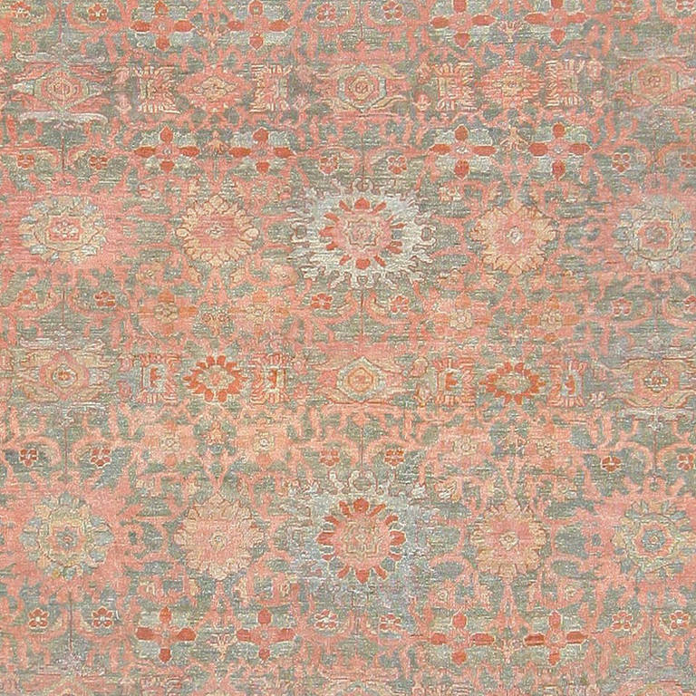 Antique Persian Sultanabad carpet, Persia, circa 1900. This truly impressive antique Persian Sultanabad rug is characterized by a gorgeous, classical design of floral design elements, with a series of spiraling vine scrolls offering their support. A