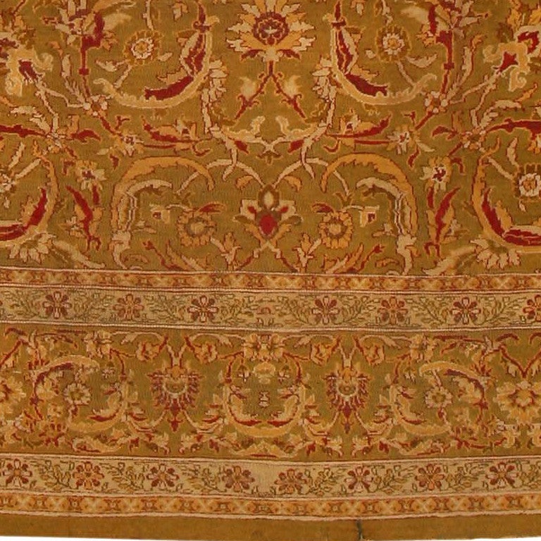 This jaw dropping  antique Oriental Amtritsar from India boasts a classic Indo-Persian design of allover arabesques with sickle palmettes in soft golds and burgundy against an abrashed green and cocoa ground.

Antique Indian Amritsar rug, Country of