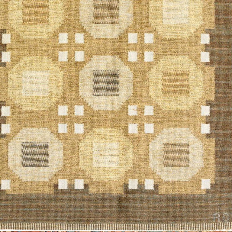 Carefully composed and well organized, this regal flat-woven rug from Sweden features an elegant repeating pattern incorporating octagonal motifs decorated with inset squares and subtle stripes. This outstanding flat-woven carpet has a regal