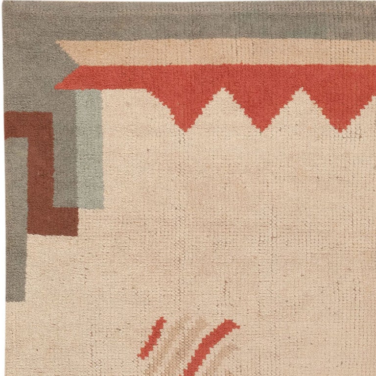 Embodying modern principles of color, form and composition, this sleek vintage Art Deco rug from France depicts a simplistic rectilinear medallion comprised of undulating ribbons. Graphic geometric patterns flank the sparsely decorated,