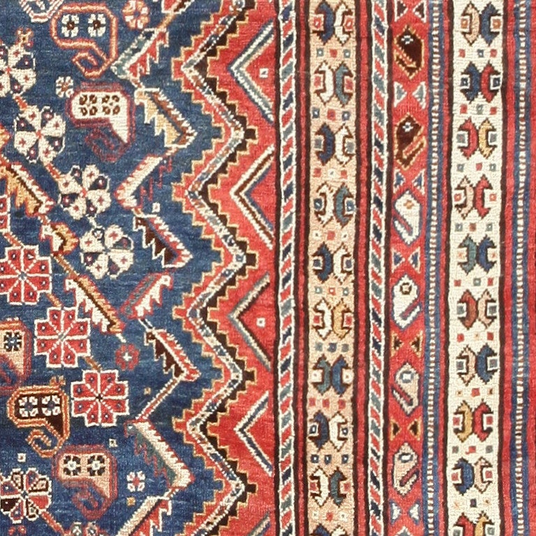 Named after the Qashqa'i tribe in Persia, these nomadic rugs represent the skillful weaving styles of the tribe. Combining unique details with traditional family motifs the rugs are heavily ornamented. They often feature geometric patterns and