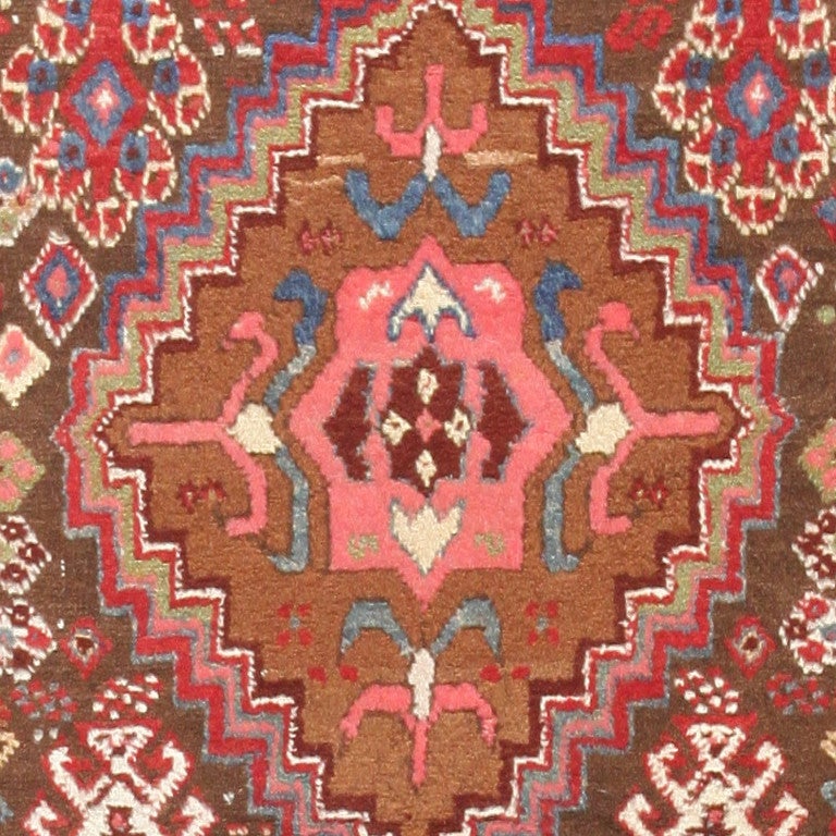 Magnificent Tribal Rare Antique Caucasian Kazak Runner Rug, Country of Origin: Caucasus, Woven Circa Date: Turn of the 20th Century. Size: 3 ft 4 in x 10 ft 6 in (1.02 m x 3.2 m)

This especially rare antique Caucasian Kazak rug is characterized