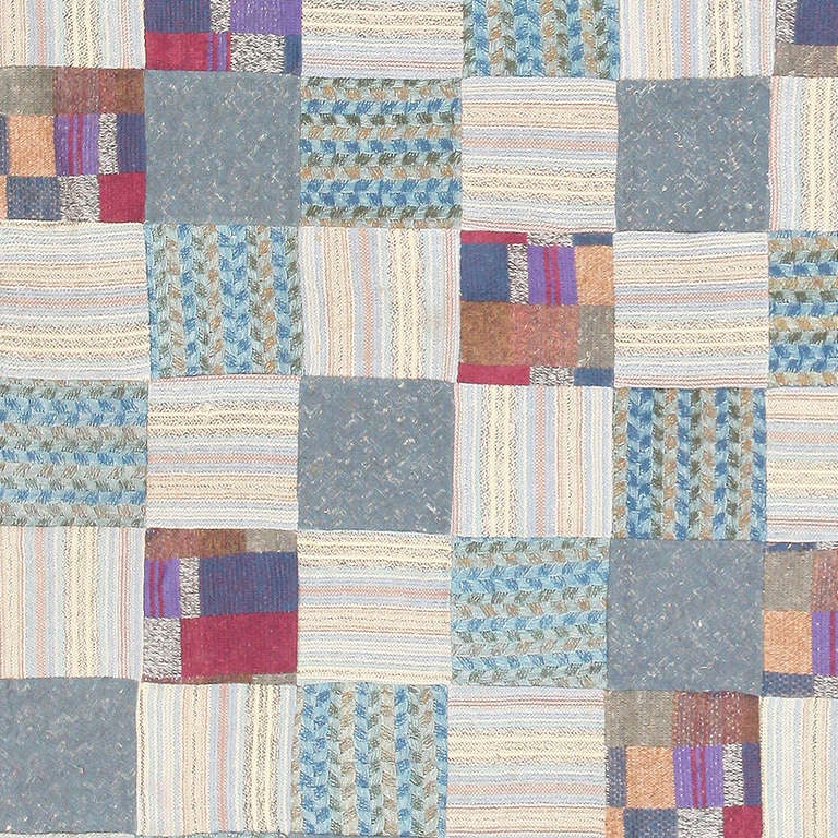 This lively patchwork carpet from the house of Missoni has a fresh, versatile visage ideal for contemporary or cottage-chic interiors. Knitted wool remnants with braided stripes, color-block squares, heathery variegation and pastel lines form a
