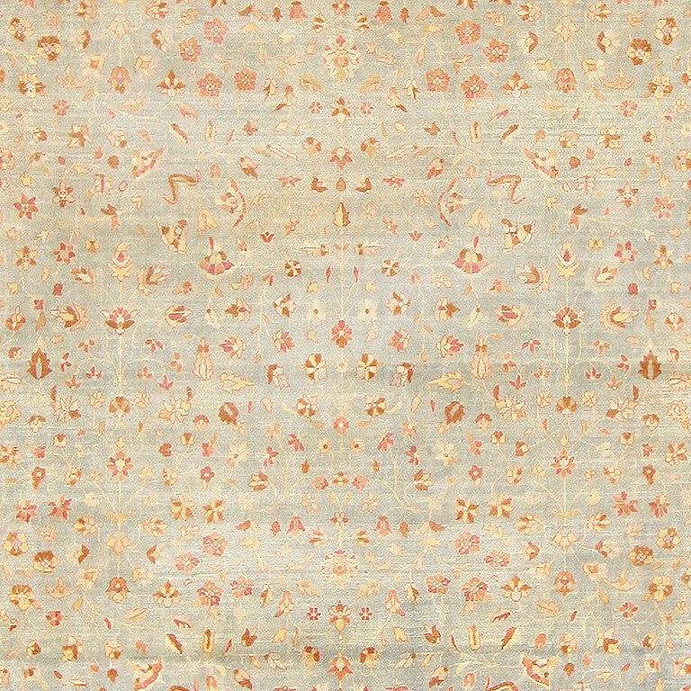 Antique floral Indian rug, India, circa first quarter of the 20th century. Here is a sublimely beautiful antique oriental rug, an antique floral carpet that was woven in India during the early decades of the 20th century. Impeccably woven