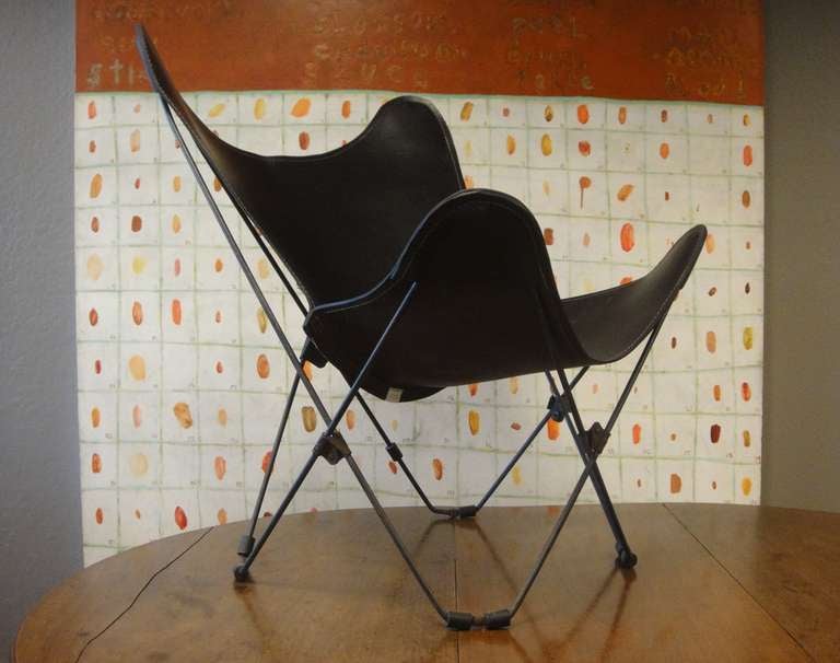 Mid Century American metal camp chairs with subtle patina. New dark brown leather seats. Approx 1950-1959. Priced for the set of chairs.