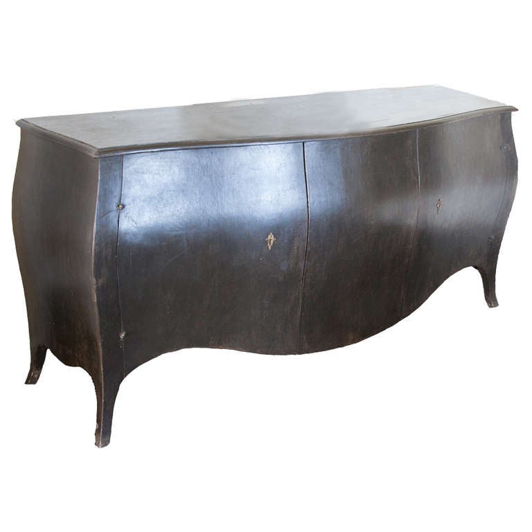 Black Commode Bombe. A newer interpretation on a classic design. Clean lines and a lovely pot-bellied shape create a unique balance that nestles comfortably between antique and contemporary. The bombe has great details in the hardware, the key and