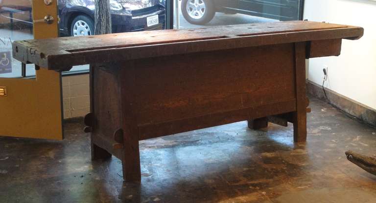 Rustic Belgium beach wood work bench from the early 1900s with metal vice.