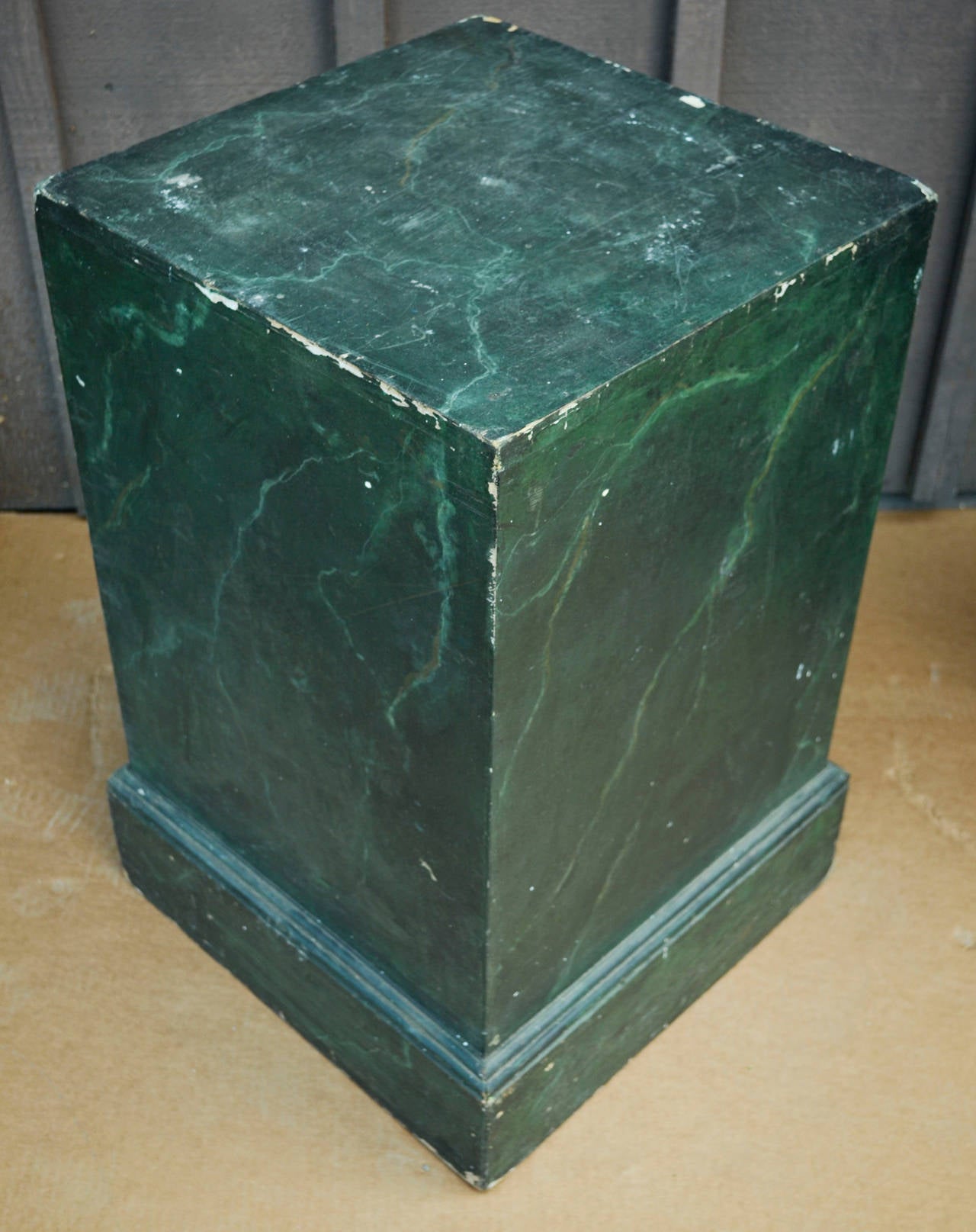 Pair of vintage wooden pedestals painted to resemble malachite, c. early 20th century. 

Some chips and signs of wear; please inquire review images for details. 