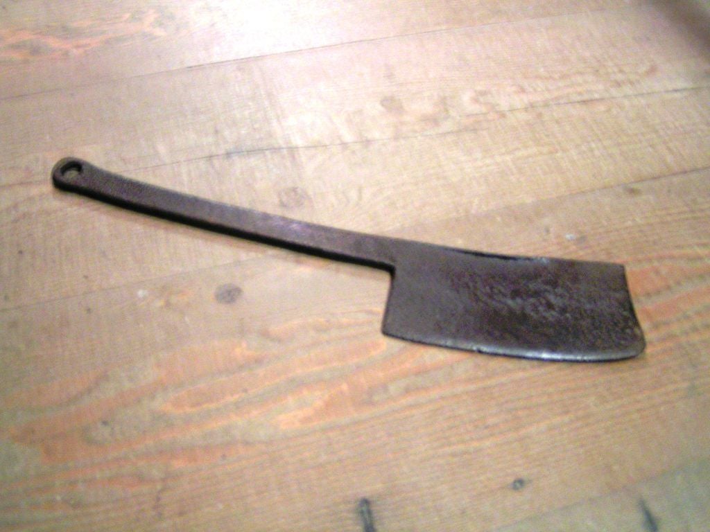 Large vintage iron cleaver from France.  Wonderful heft, great character as one would expect from an antique kitchen implement.