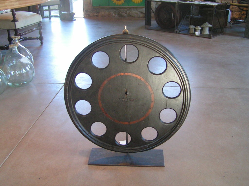 Large, handcrafted Industrial mold. Used in sand casting processes to create Industrial machine parts in metal. Has a hanger in back, can be attached directly to a wall and also comes with a fabricated metal display hanger.