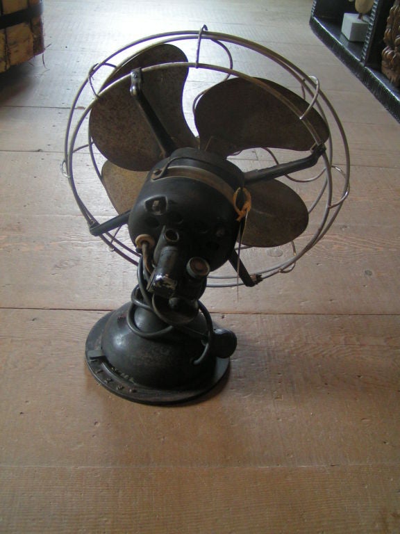 Very cool, heavy old desk fan with great patina on blades.  The plug is outdated.  Could be functional, and still a great objet/design element.