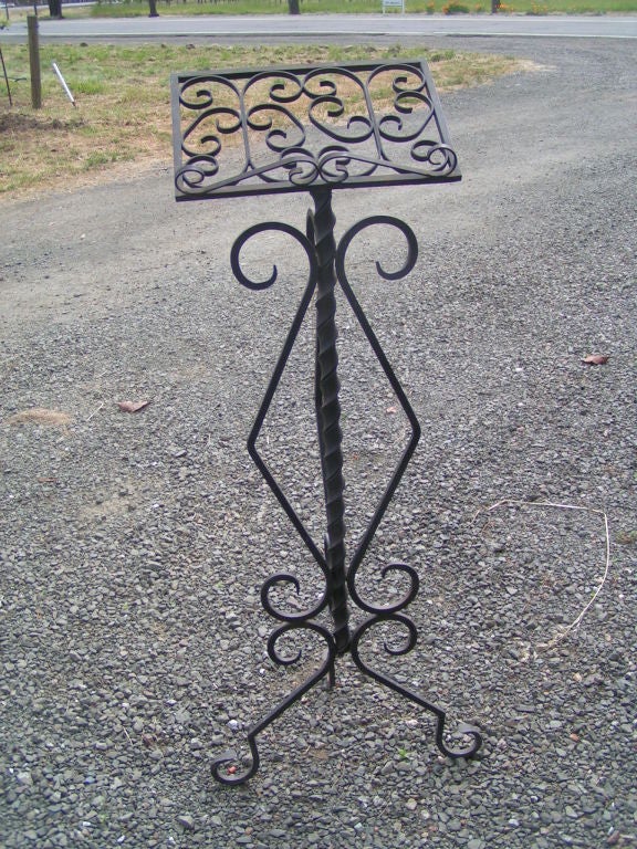Beautiful wrought iron music stand.  Would make a beautiful presentation in a home or conservatory, or perhaps a hostess stand in a restaurant.