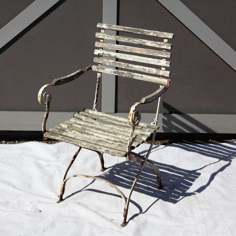 French wood and metal garden chairs circa 1880. Charming patina and chipping paint character. Please see pictures for details.