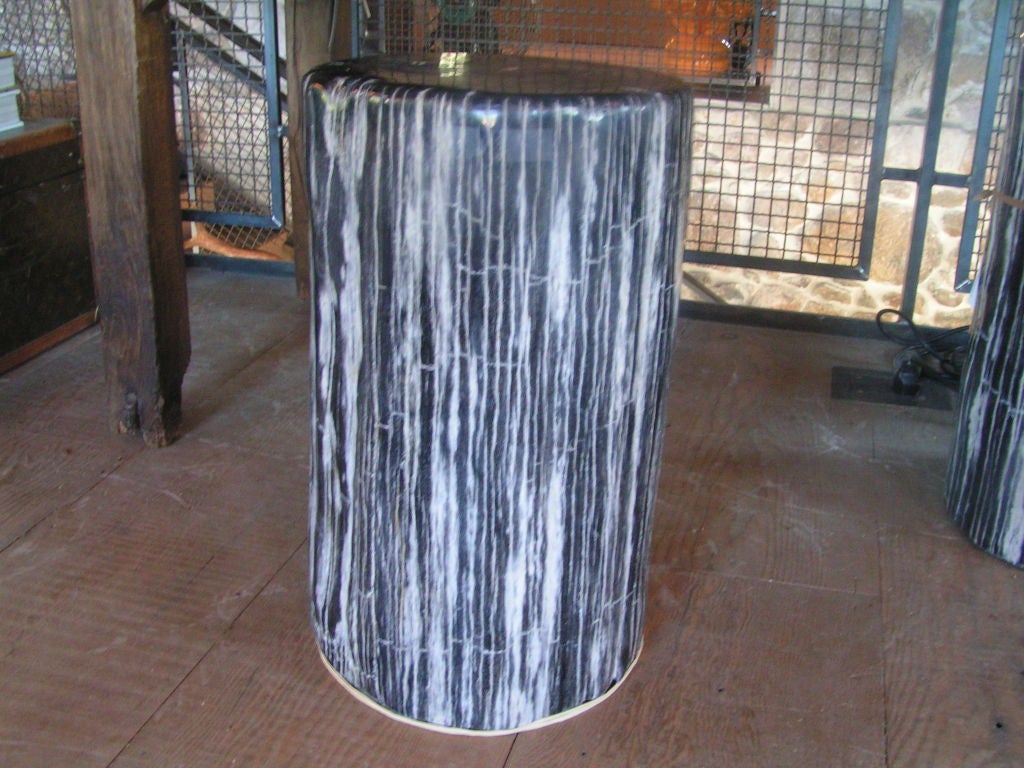 Black and white striated petrified wood stool.  This makes a lovely pedestal, stool or side table.  This eye-catching and versatile object works beautifully with any style, from rustic to contemporary.