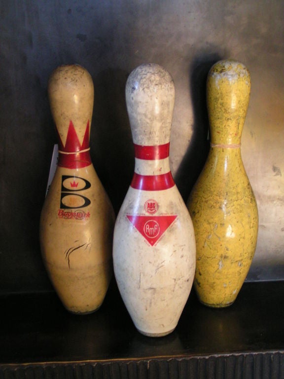Eight vintage bowling pins currently available, all are unique, all are wonderfully scuffed and marked with various manufacturer attributions. A wonderful slice of Americana! Sold individually