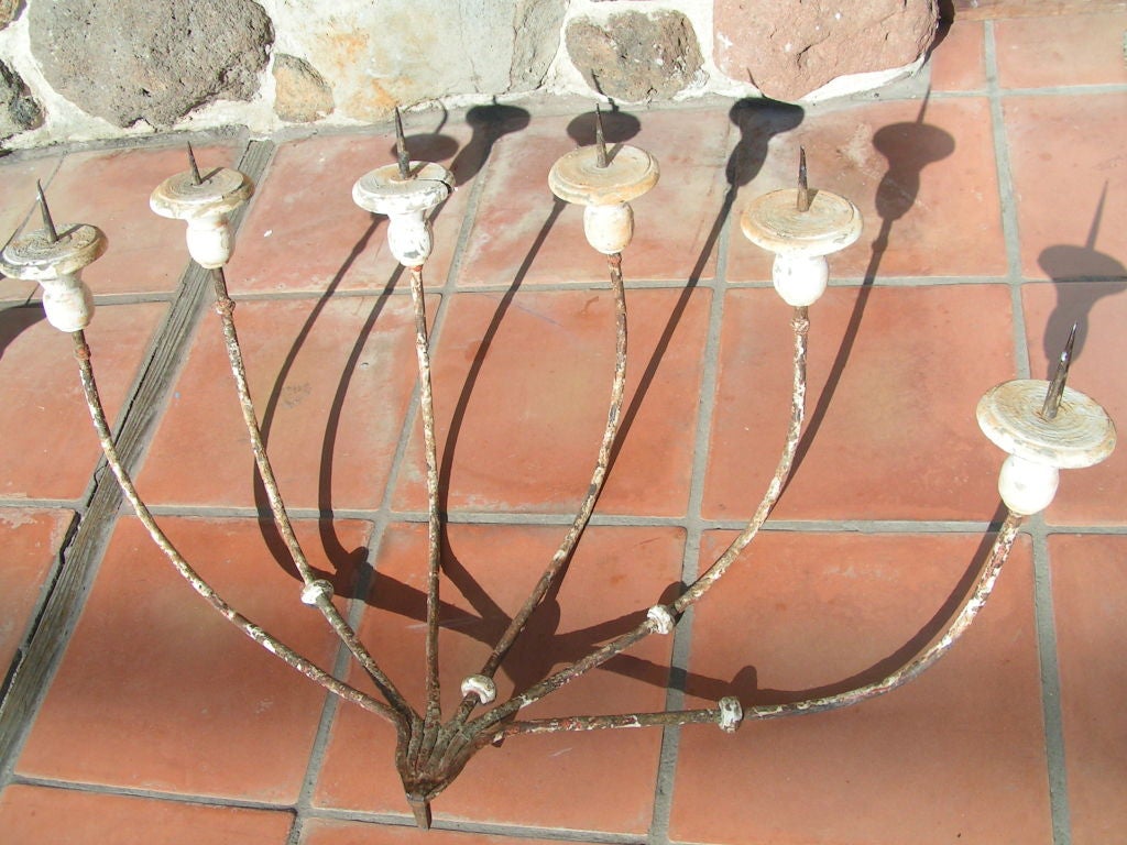 This is the centerpiece of a set of antique wall applique candelabras from Italy.  This one also does not have the hanging bracket for the wall.  All the candle holders are on the same visual plane.  We have an additional set of two that would flank