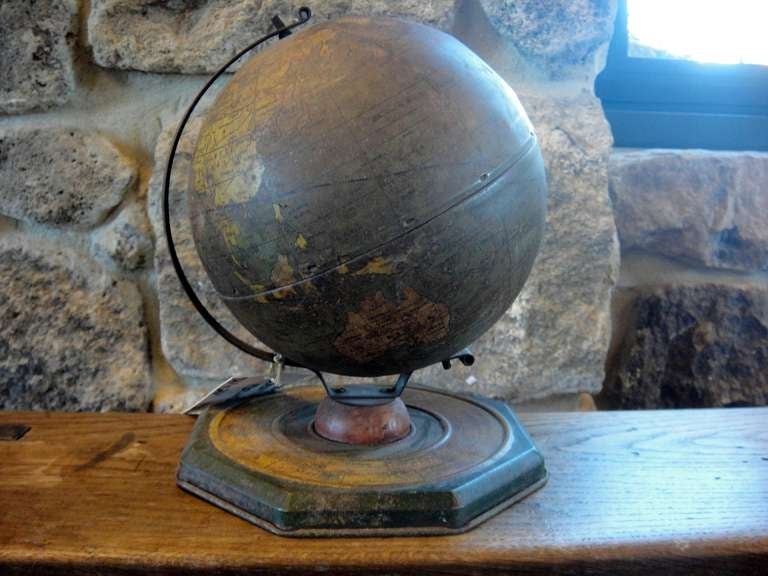 Mid century tin globe by J. Chein with astrological base. Lovely dark patina with worn surface.