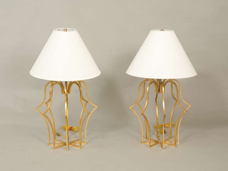 Pair of great Hollywood Regency look gilded iron table lamps. Circa 1950's.