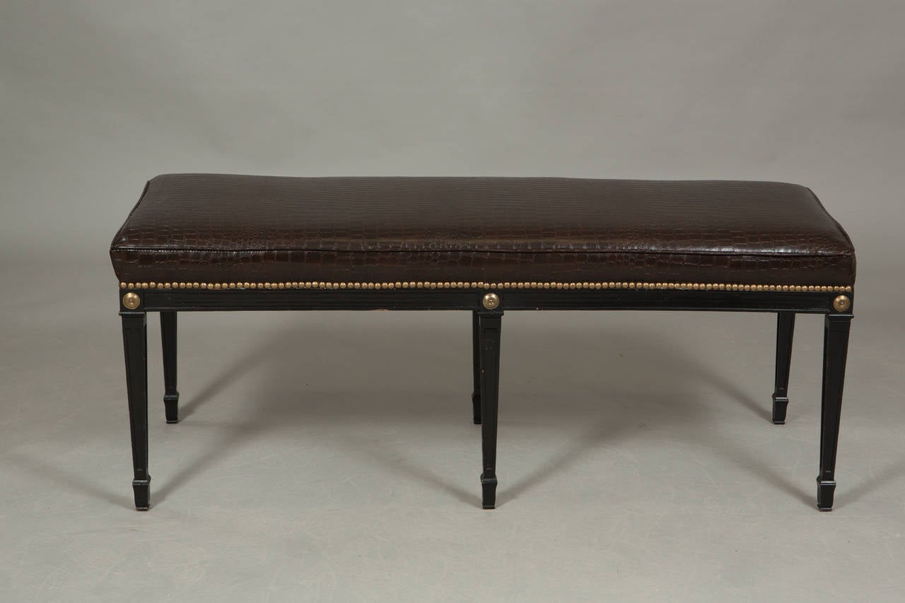 Black painted, faux alligator, Louis XVI style benches with brass French nailhead trim and tapered legs.