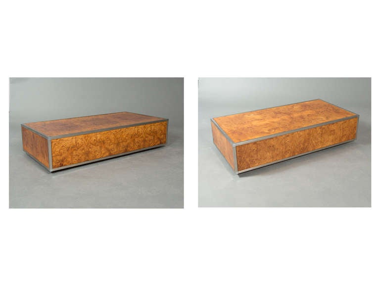 Pair of low Mid-Century, Milo Baughman look coffee tables composed of burl wood panes with brushed metal frames.
Two Pieces available. Can be sold individually - $2100 each. Photos 2-5 are of the first table. Photos 6-9 are of the second table.