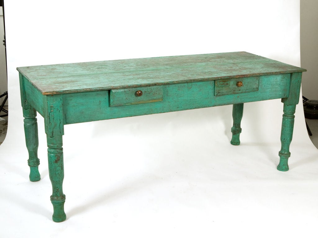 Charming rustic antique Latin American painted farmhouse table in vibrant distressed turquoise paint, with turn drawers and turned legs.