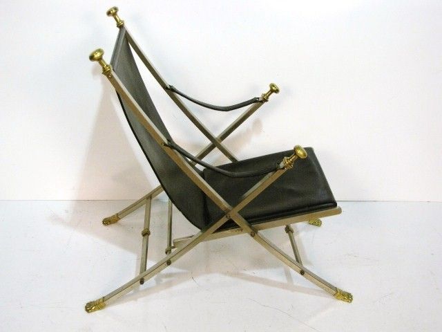 Pair of Mid-Century Jansen Neoclassical black leather and chrome campaign chairs with brass mounts.