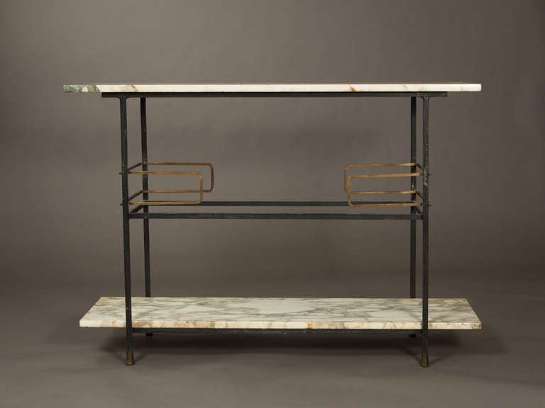 Handsome Italian console table with gilt detailing and vintage white Carrara marble top. Beautiful patination on heavy metal frame.