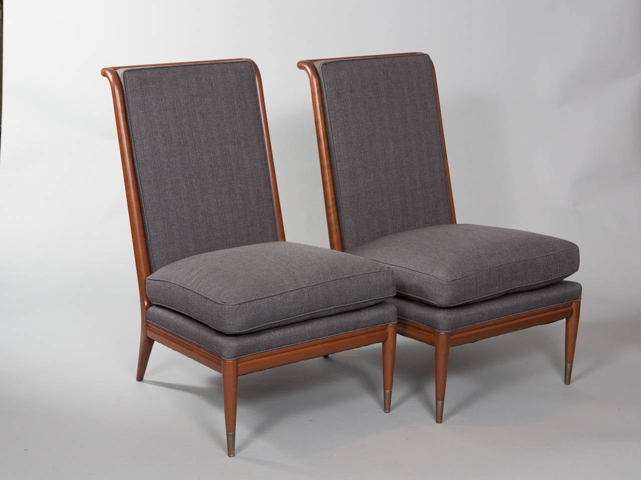 Pair of John Stuart for Widdicomb 1950's walnut slipper chairs. Tapered legs ending with brass sabots and a handsome dowel rod back. Newly upholstered and restored.
Seat depth - 23