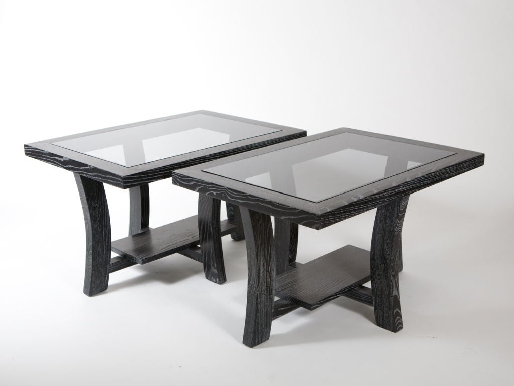 Pair of Paul Frankl black cerused Mid-Century modern end tables with stepped motif and smoke glass top.
