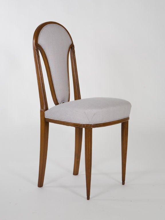 Elegant, French Art Deco side chairs with reeded legs. Newly upholstered in pale grey raw silk.<br />
18.5