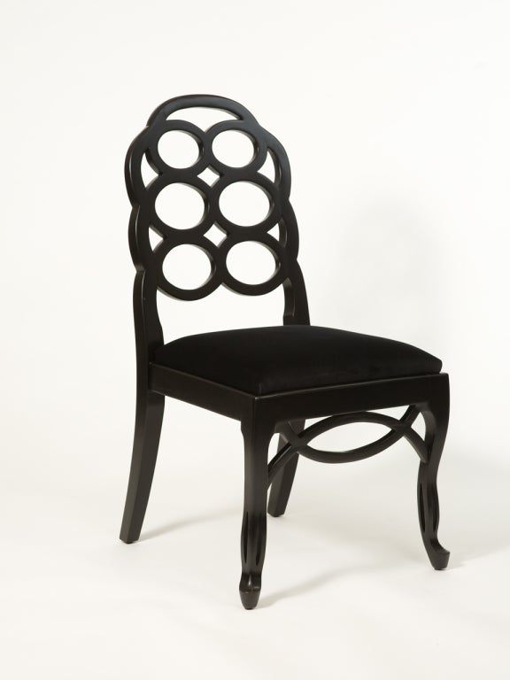 Four black painted Frances Elkins style loop side chairs. Newly upholstered in black velvet.
19