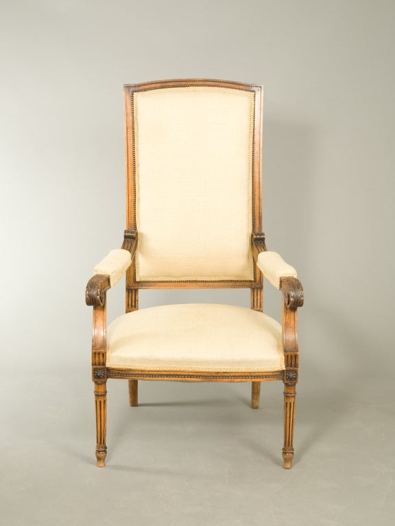 Louis XVI style high back fauteuil with carved wood frame and textural woven putty color upholstery. Seat height - 16.5