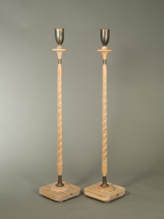 Pair of Mid-Century modern oak floor lamps with cerused finish and patinated brass accents, attributed to Russel Wright. To be rewired upon purchase and glass diffusers provided upon purchase.
52