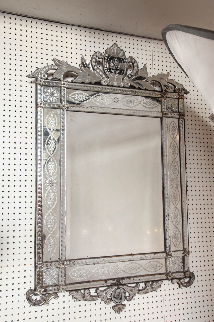 Venetian mirror with hand-carved glass.

Handpicked by buyers at Ann-Morris, Inc.