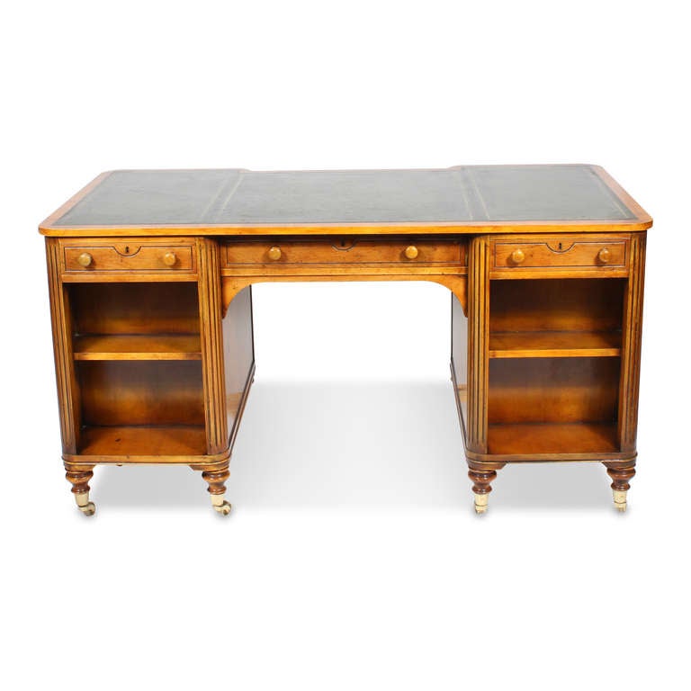 This is a wonderful piece of furniture, designed for the library or office, with 12 shelves for books, four on the front and back, and two on each end, all below incised drawers with wood pulls, the drawers at the front of the desk are functioning,