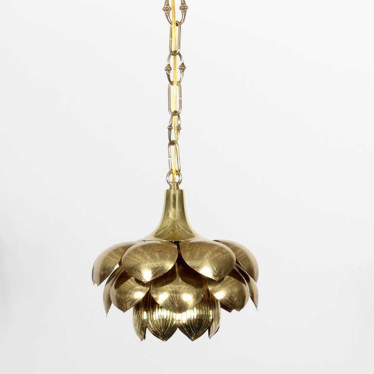 An etched brass pendant lotus light, probably by Feldman of California, in the style of Tommi Parzinger. Newly cleaned and wired, with added decorative chain and canopy. Three available, priced individually. Measurements are for the pendant itself,
