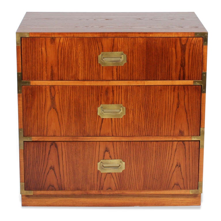 A pair of 3 drawer hardwood campaign style chests with inset brass pulls and hardware.  Newly polished.